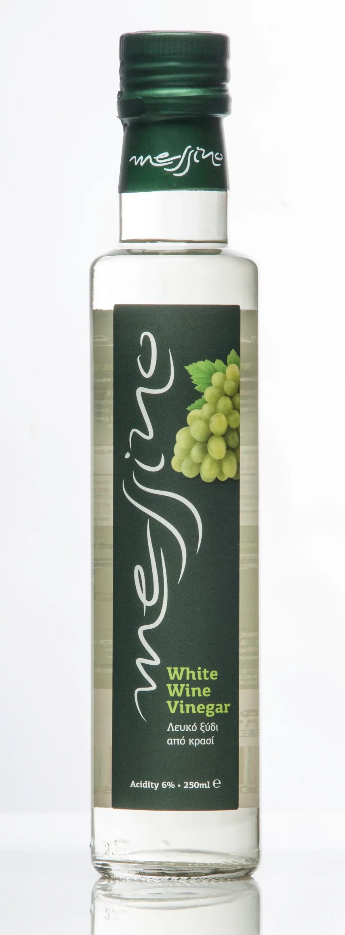 Bottle of white wine vinegar with a green cap on a white background